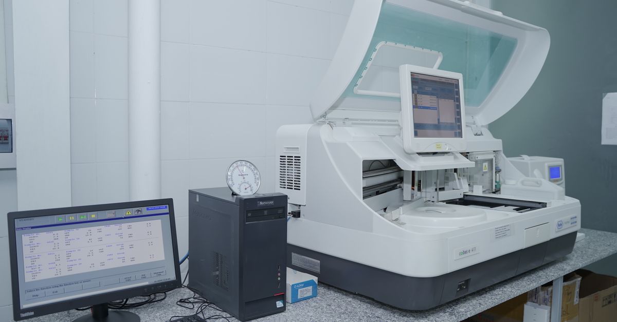 High-tech laboratory equipment with computer system in lab setting.